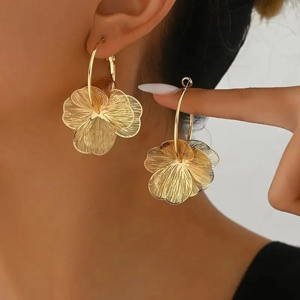Floral Earrings with Sculptural Metal Design and Snap Closure - Image 1