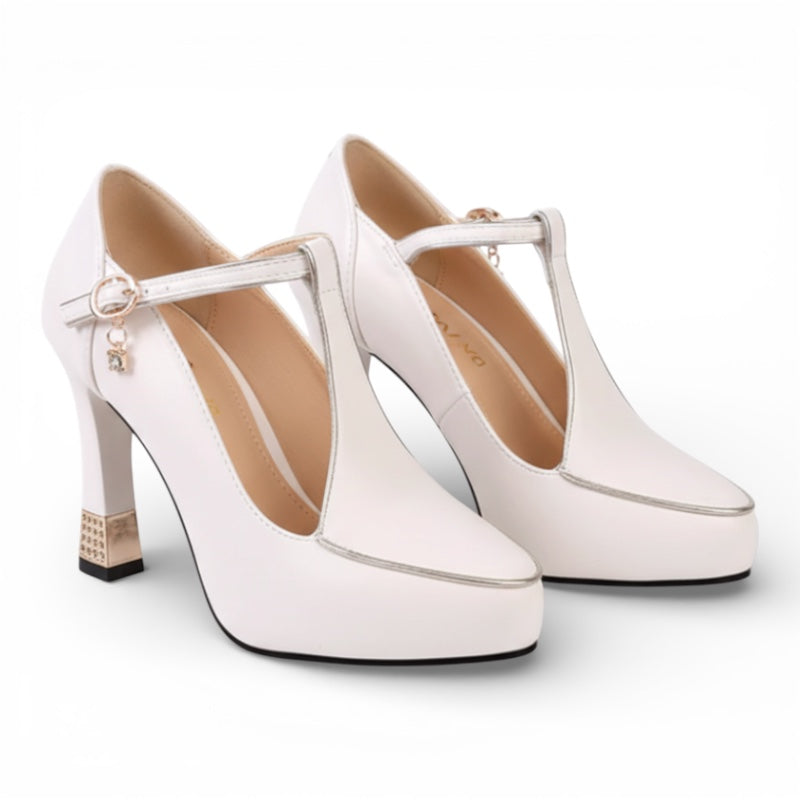 White high-heeled shoes with T-straps on a white background