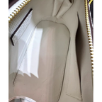 Leather Handbag with Flattering Top Handle and Gold Hardware - Image 9