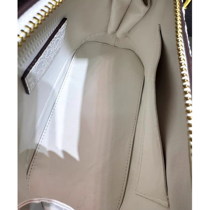 Leather Handbag with Flattering Top Handle and Gold Hardware - Image 9