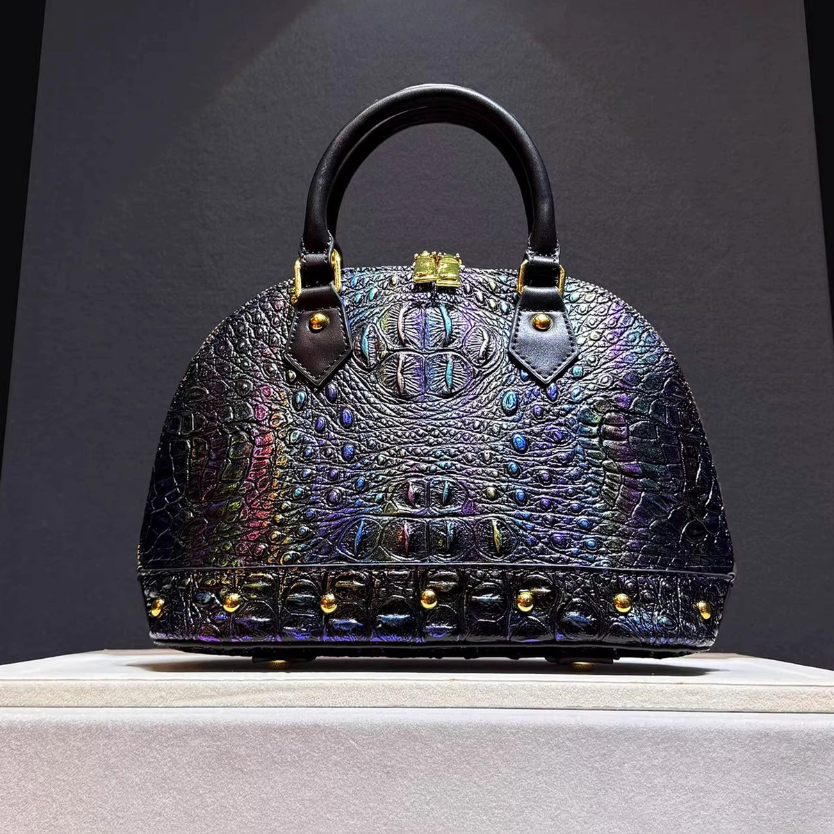 Leather Handbag with Flattering Top Handle and Gold Hardware - Image 1