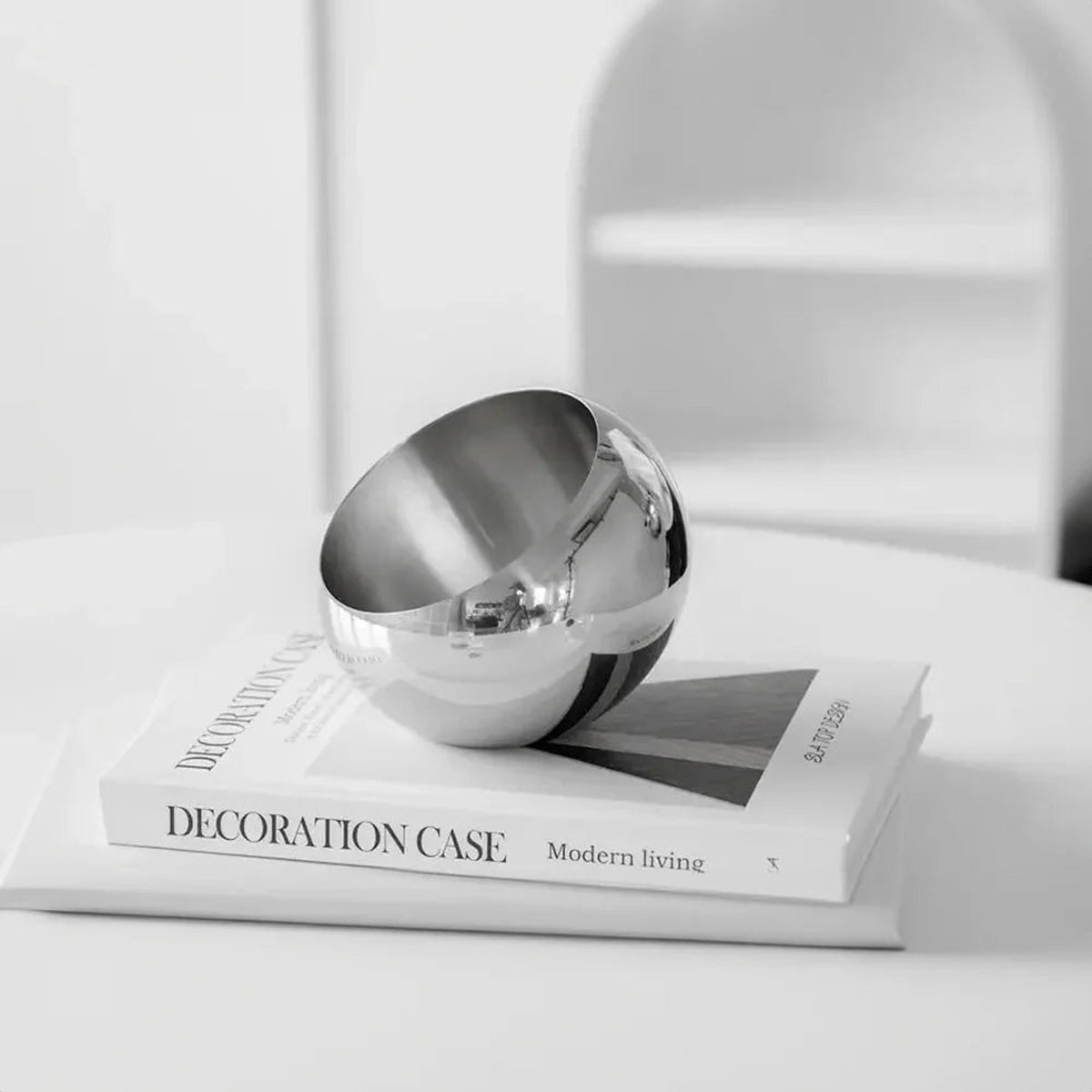 Polished Stainless Steel Fruit Bowl With Modern Open Design - Image 2